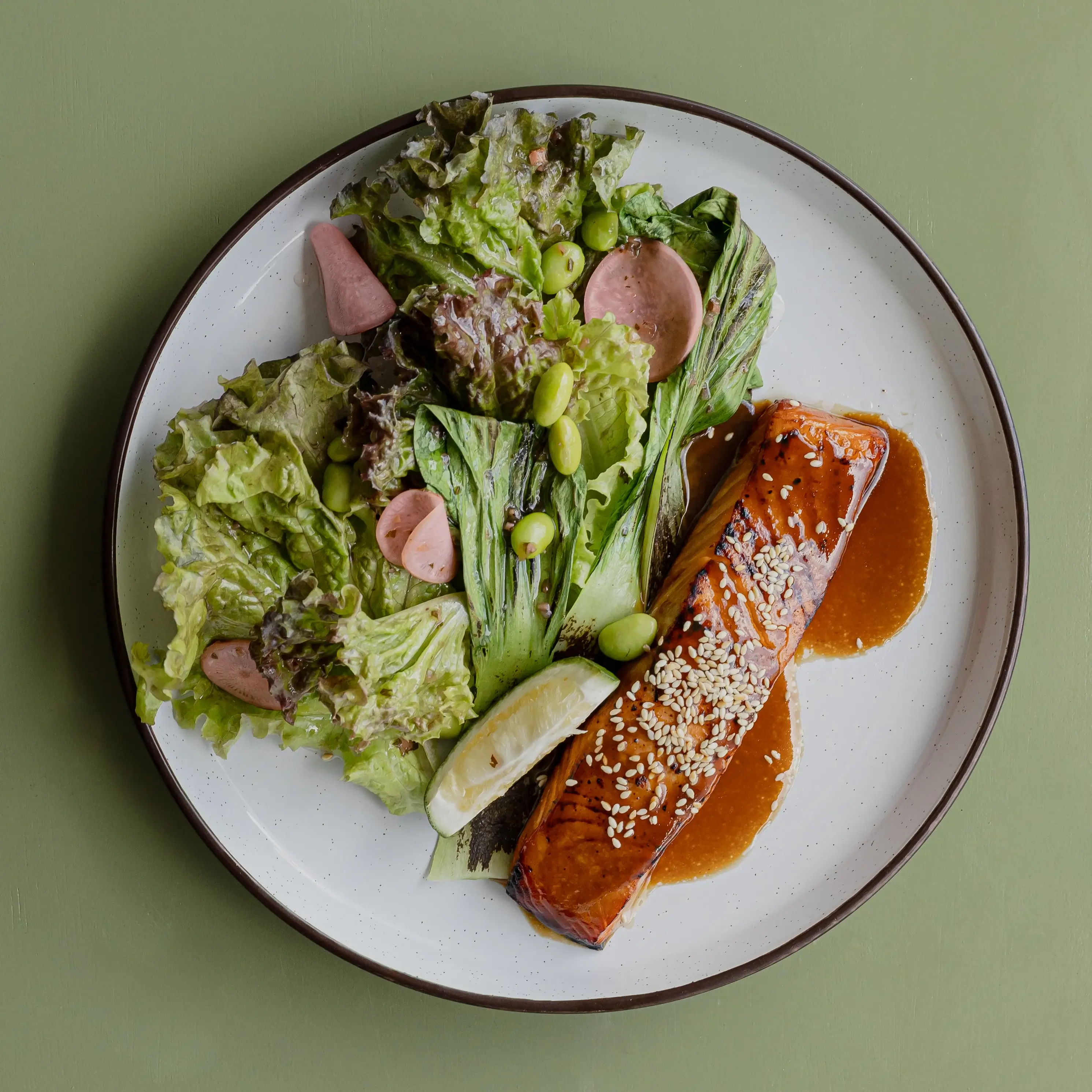 Miso caramel-glazed Salmon, red lettuce, edamame, roasted bokchoy